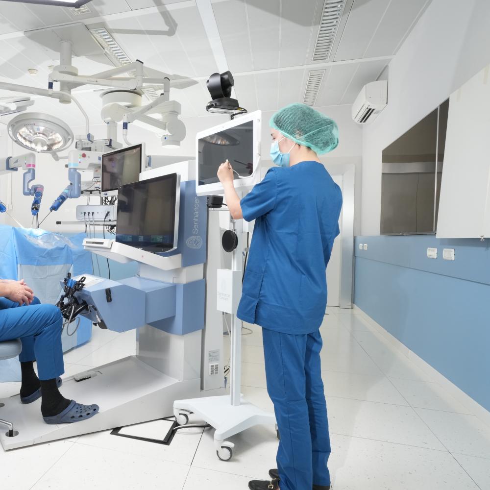 A doctor pointing at a monitor